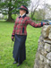 Maple leaf tartan. Double breasted slanted front jacket with navy velvet trim shown with navy skirt.JPG